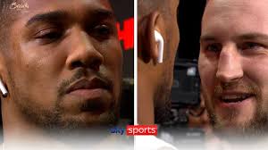 Anthony Joshua displayed no emotion as Otto Wallin delivered some parting  words before Saturday's fight. Sky customers can purchase
