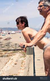 Middle Aged Couple Relaxing On Beach Stock Photo 269329892 | Shutterstock