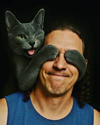 Create a cartoonish image that depicts a humorous and stylized illustration  featuring a fish with exaggerated human-like facial features, including  large lips and eyes, smoking a cigarette. Next to the fish, there