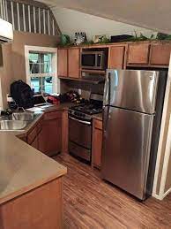 Playhouse Turned Into A Cozy Tiny Home Tiny House Kitchen Tiny Kitchen Design Shed To Tiny House