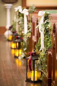 Your wedding flowers will compliment and work in harmony with your wedding style. An Elegant Winter Wedding With Christmas Spirit Belle The Magazine Wedding Ceremony Decorations Church Church Wedding Ceremony Wedding Ceremony Decorations