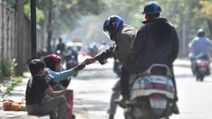 giving alms to beggars in Indore