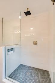 Gorgeous Walk In Shower With Custom Frameless Glass Shower Doors Features Marble Look Porcelain T Glass Shower Doors Frameless Shower Doors Glass Shower Doors