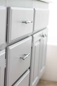 Now comes the fun, it's time to paint the bathroom cabinets! Builder Boring To Gorgeous Gray Cabinets Domestically Speaking