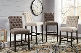 Table measures 42 w x 42 d x 36 h, and each bar stool chair measures 17 w x 21.5 d x 41 h assembly required: Tripton Counter Height Bar Stool Ashley Furniture Homestore