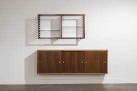 Albini designed a tiny room, in which each element fulfilled one or more functions: Franco Albini Bookshelf And Wall Mounted Cabinet