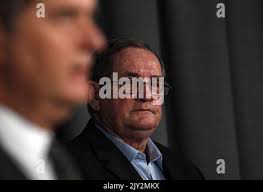 Barry Guise (right), father of Jason Guise, is seen as Queensland Police  Detective Inspector Owen Elloy appeals for information about Jason's  suspicious death during a press conference in Brisbane, Friday, June 21,