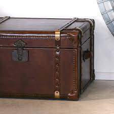 Large vintage travel trunk storage coffee table footstool. Vintage Leather Trunk Coffee Table La Maison Chic Luxury Interiors
