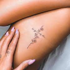 Beautiful cross tattoo on ribs. Fine Line Flower Cross Tattoo On The Rib