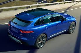 The Jaguar F Pace Blue Color Car On Road Hd Wallpaper Blue Cars Jaguar Suv Jaguar Sport New Jaguar