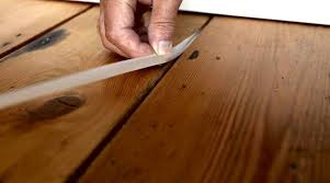 Steady the tool with one hand and give the side furthest from the gap a couple whacks to move the loose plank closer to the one it's drifted away from. Repair Of Wooden Floor How To Close Up The Gap In The Apartment How To Patch Up The Boards How To Repair And Fix The Creak