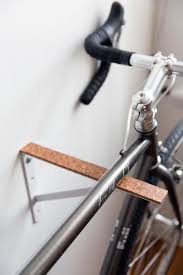 Bike Racks From Simple Inexpensive Shelf Brackets And Thick Pieces Of Cork The Cork Is Coated In Polyurethane Diy Bike Rack Bike Storage Bike Storage Inside