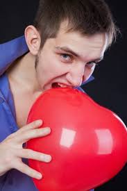 Man Bläst Rote Ballon Isoliert Auf Weiß Lizenzfreie Fotos, Bilder und Stock  Fotografie. Image 13162378.