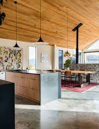 This Striking Queenstown House Makes The Most Of Its Remarkable Views Modern Farmhouse Kitchens Polished Concrete Flooring Polished Concrete