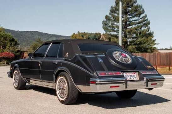 1985 Cadillac Seville Elegante Custom. Along with added chrome custom front grills, trunk belt straps, and a Continental Spare Tire Cover on the trunk. Pictures from California