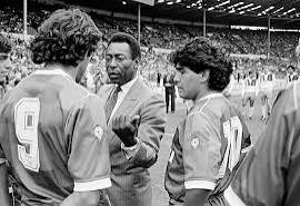 The photo shows Maradona and Platini alongside Pelé during a celebratory match at Wembley Stadium in 1987. Pelé appears as a guiding mentor, giving advice while both stars listen attentively. Notably, Platini