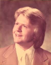 1975 and just got my graduation picture taken.