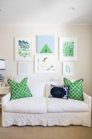To show off your style, layer sheepskin, velvet and leather pillows over your furniture. Green Maze Pattern Pillows On White Slipcovered Sofa Cottage Living Room