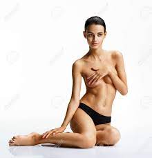 Beautiful Athletic Topless Woman Posing Sitting On White Background. Photo  Slim Tanned Of Girl. Beauty And Body Care Concept Stock Photo, Picture and  Royalty Free Image. Image 70396601.