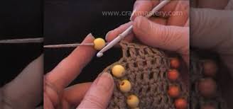 Add beads in pattern indentations, at the sides or centers of cables, or in the openings created by eyelet stitches. How To Add Beads To Crochet Projects Knitting Crochet Wonderhowto