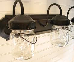 Small jars are perfect for cotton balls or swabs, medium jar perfect for brushes or toothbrushes. Vintage Clear Canning Jar Triple Vanity Sconce Etsy In 2021 Mason Jar Bathroom Mason Jar Lighting Jar Lights