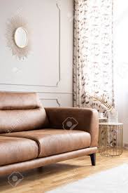 Brown & gold zebra wild animal print exotic glam shower curtain. Bright Living Room Interior With Gold Mirror Brown Leather Lounge Stock Photo Picture And Royalty Free Image Image 111300186