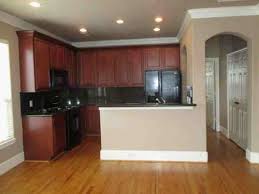 It has no place in anyone's kitchen. Mismatched Wood And Cabinets In Open Kitchen Living Area Help