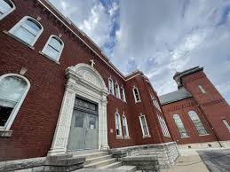 Fr. Schomaker builds with Faith, Hope and Love