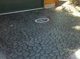 How to tape off a concrete patio and use a concrete stone paint faux finish technique to create a stone/slate tile looking patio. Stamped Concrete Don Johnson Masonry