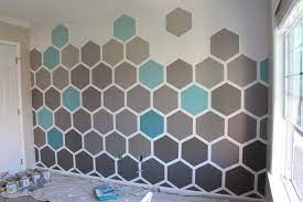 Paint a hexagon patterned wall. Grosgrain Honeycomb Ombre Hexagon Accent Wall