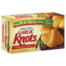 Eight garlic knots are served with pizza sauce for dipping. New York Hand Tied Garlic Knots Shop Bread At H E B