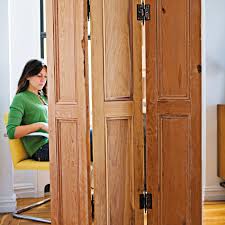 A room divider is great idea to do that, and you needn't buy one, let's diy it! How To Make A Folding Screen Using Old Hinges And Shutters This Old House
