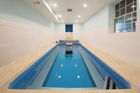 Swimming in a swim spa recruits different muscles and requires more body awareness in the water. Install A Lap Pool Or Swim Spa Indoors Even Basements Pool Endless Pool Indoor Spa