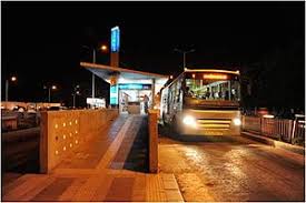 Image result for images of persons waiting for bus at bus stand at night