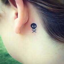 This tattoo includes a black and white inked skull with red ink filled in the eyes and mouth of the skull. Top 9 Terrible Crossbones Tattoos Designs Styles At Life