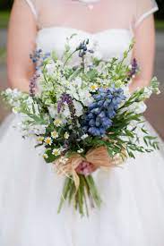 Though this bride tied the knot in early fall, she wanted to stick to a color palette of white and green. 22 Beautiful Bouquets That Can Double As Your Something Blue Wedding Flowers Wildflower Wedding Wedding Bouquets