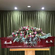 Cascading casket flower arrangements are elegant. The Casket Spray I Made For My Nanna S Funeral Australian Natives Roses Casket Spray Funeral Flow Casket Flowers Funeral Floral Arrangements Casket Sprays