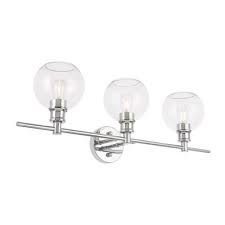 If your bathroom has a double vanity, you can also choose to mount two fixtures, one over each sink and mirror. Wrought Studio Vallie 3 Light Vanity Light Shade Color Clear Finish Chrome Vanity Lighting Vanity Light Shade Contemporary Style Lights