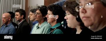 Plaintiffs seen right to left, Floyd Sklaver; Tim Smith; Ken Colby; Becky  Hansen; Kathy Flynn; Kelly Burke and Dolores Doyle look
