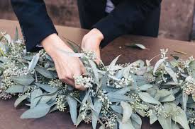 Kick Off The New Year With A Fresh Eucalyptus Centerpiece Wedding Reception Backdrop Wedding Flowers Eucalyptus Centerpiece Disposable table runners for parties.