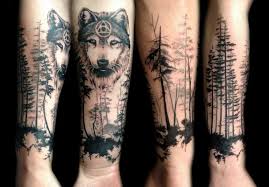 Black And Grey Wolf Head With Forest Tattoo On Arm Forest Tattoos Wolf Tattoos Forrest Tattoo