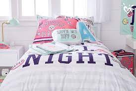 Layer Shimmery Varsity Inspo Pillows Over Cool Graphic Bedding For A Style She Ll Cheer For Cool Room Designs Pastel Girls Room Girly Bedroom