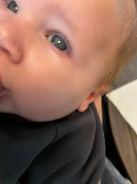 My son, husband and I all have some variant of brown eyes but our little  girl (3 months old) looks as though they're dark grey ? Do we think they'll  change?