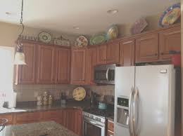 However, they kept it from looking cluttered by using mostly wire baskets which have a lot of open space. 19 Best Images About Kitchen Top Of Cabinets On Pinterest Top Kitchen Cabinets Decor Kitchen Cabinets Decor Decorating Above Kitchen Cabinets
