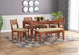 The curved backrests and padded seats are covered with. Buy Cambrey 6 Seater Cushioned Dining Set With Bench Honey Finish Online In India Wooden Street