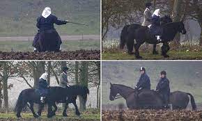 prince andrew joins the queen for a trip out horse riding in the windsor castle grounds