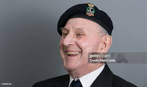 Normany veteran Eddie Linton laughs as he gets ready to pose for a... News  Photo