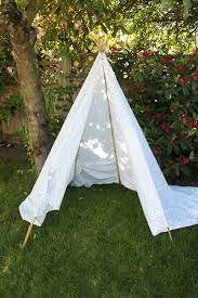 If little crafters get impatient with holding the sticks in place while the glue dries, clamp the sticks with binder clips to hold them in place. Super Simple 5 Minute Backyard Teepee Mama Papa Bubba