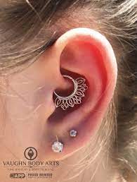Christina Stopped In Yesterday And Had Cody Pierce Her Daith She S The Proud New Owner Of This Stun Daith Piercing Jewelry Tourmaline Earrings Daith Jewelry