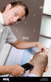 Receiving a haircut hi-res stock photography and images